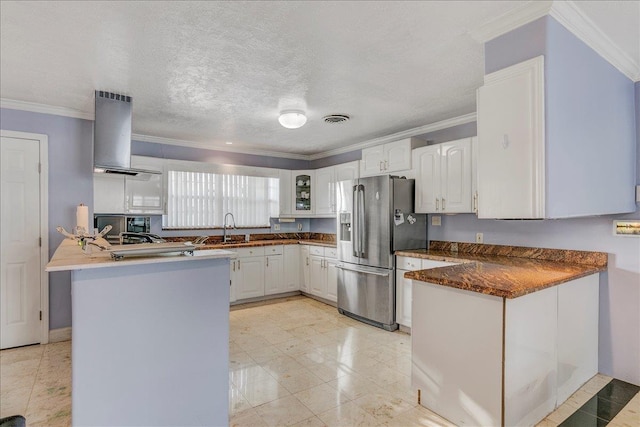 kitchen featuring sink, stainless steel fridge with ice dispenser, a textured ceiling, white cabinets, and exhaust hood