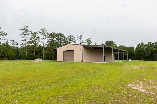 114 Holmes Rd, Lumberton, TX 77657 - view of pole building with a lawn