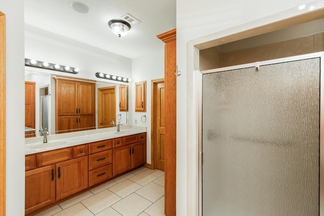 114 Holmes Rd, Lumberton, TX 77657 - bathroom featuring a shower stall, tile patterned floors, and double vanity