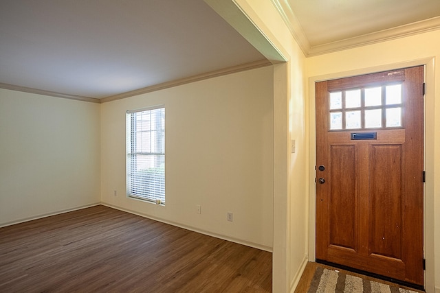 entrance foyer with dark hardwood / wood-style floors and crown molding