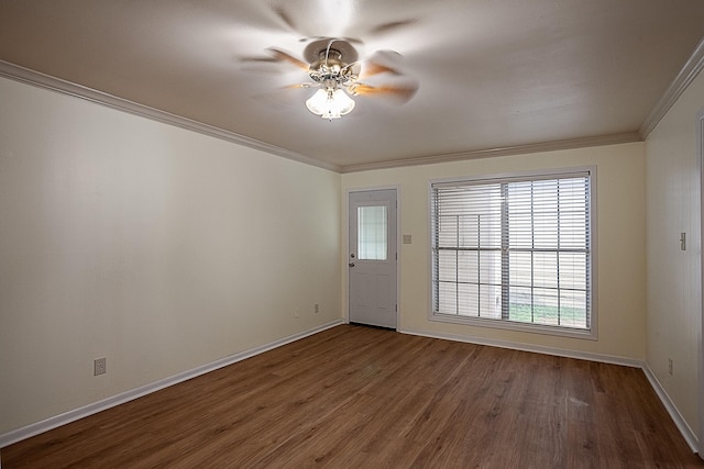 empty room featuring dark hardwood / wood-style flooring, ceiling fan, and ornamental molding