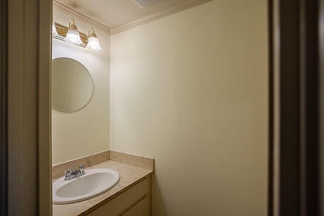 bathroom with vanity and ornamental molding