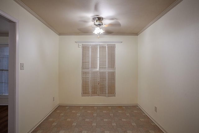 unfurnished room with ceiling fan and crown molding