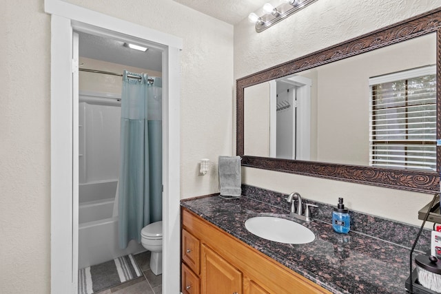 full bath with vanity, shower / bathtub combination with curtain, tile patterned flooring, toilet, and a textured wall