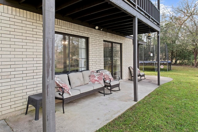 view of patio featuring outdoor lounge area and a trampoline