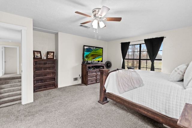 bedroom featuring visible vents, carpet floors, and ceiling fan