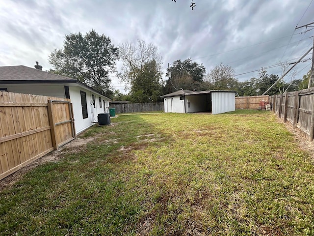 view of yard with a shed and central air condition unit