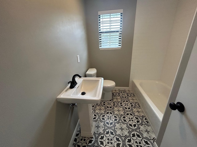 bathroom featuring tile patterned flooring and toilet