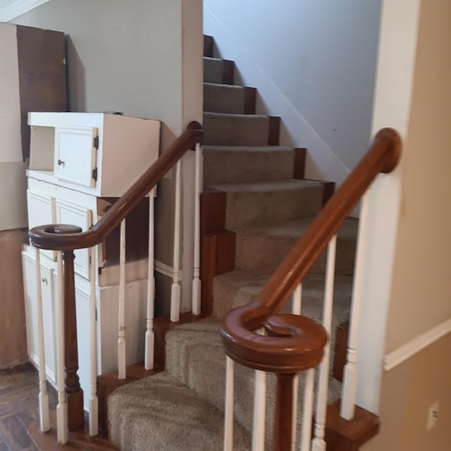 stairs with wood finished floors