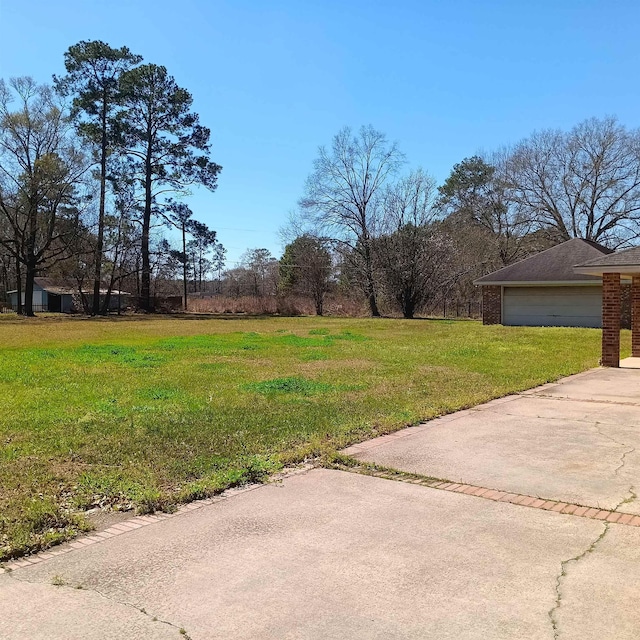 view of yard featuring a garage