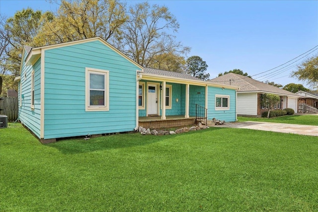 view of front of property featuring covered porch and cooling unit