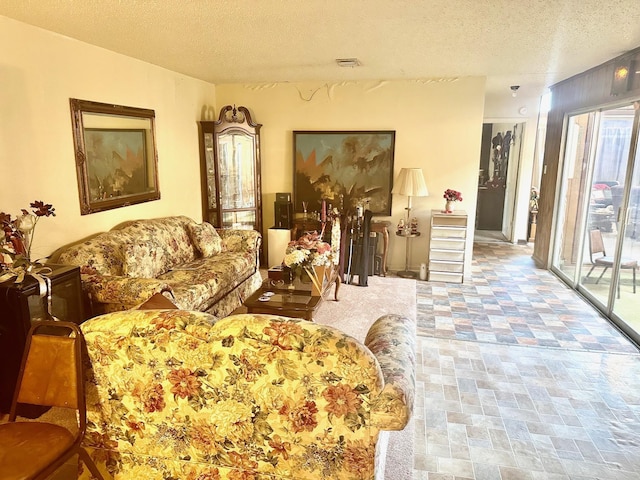 1895 Lucille St, Beaumont, TX 77705 - living room featuring a textured ceiling