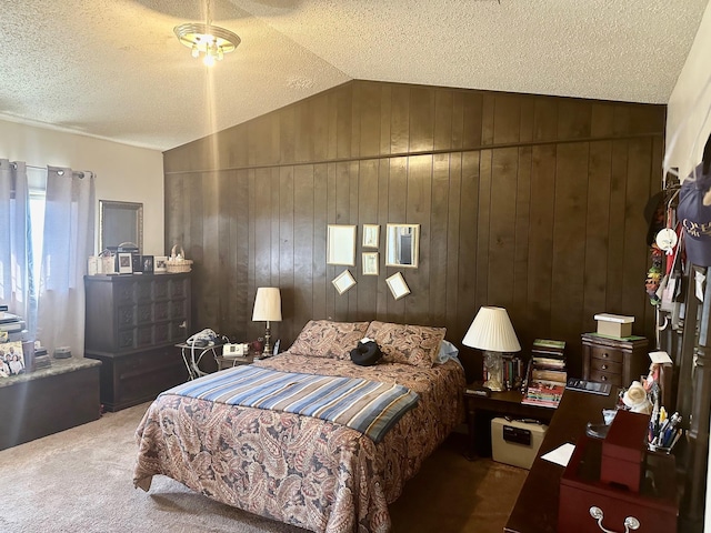 1895 Lucille St, Beaumont, TX 77705 - carpeted bedroom featuring lofted ceiling, wooden walls, and a textured ceiling