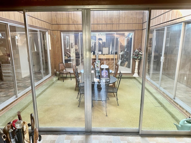 1895 Lucille St, Beaumont, TX 77705 - sunroom with wood walls and carpet flooring