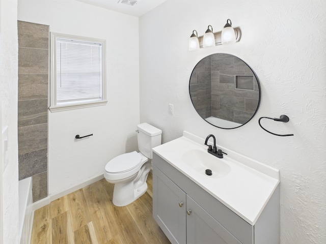 1832 19th St, Port Arthur, TX 77640 - bathroom featuring wood finished floors and vanity