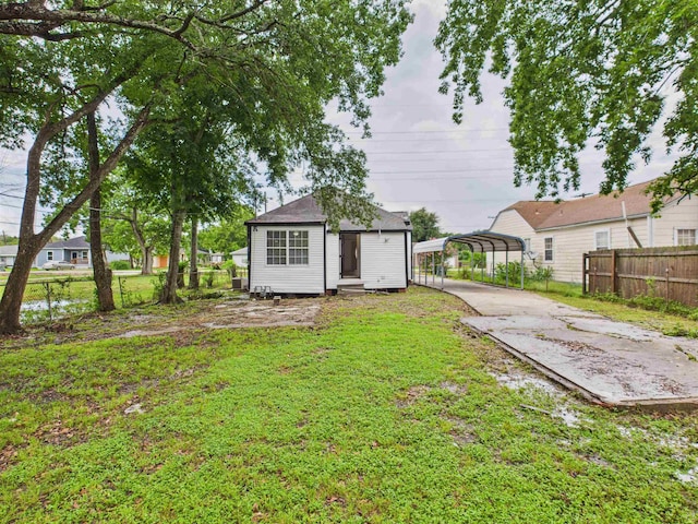 1832 19th St, Port Arthur, TX 77640 - view of outbuilding with a carport and concrete driveway