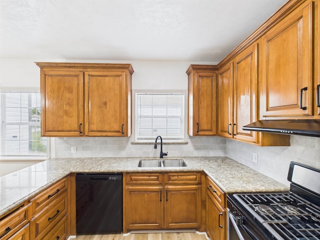 1832 19th St, Port Arthur, TX 77640 - kitchen featuring black dishwasher, stainless steel gas range oven, decorative backsplash, and brown cabinets