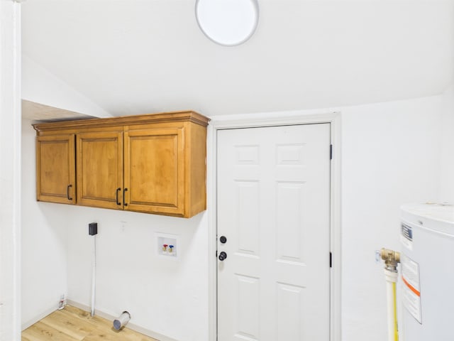1832 19th St, Port Arthur, TX 77640 - laundry room featuring light wood-type flooring, water heater, hookup for a washing machine, and cabinet space