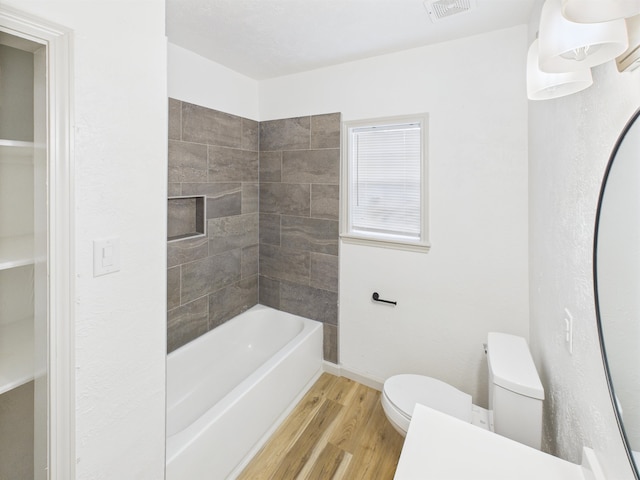 1832 19th St, Port Arthur, TX 77640 - bathroom with wood finished floors and tub / shower combination