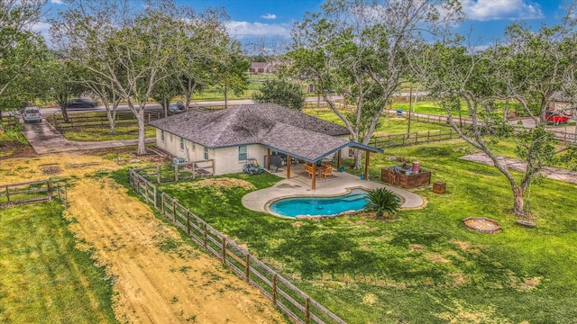 view of pool with a yard and a patio