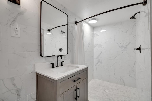 bathroom featuring vanity and curtained shower