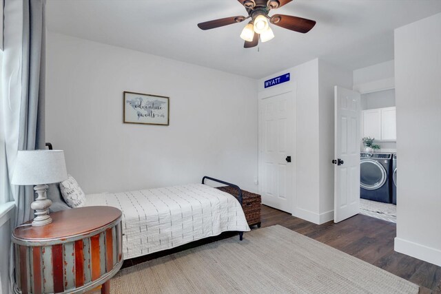 bedroom with dark wood-type flooring, independent washer and dryer, and ceiling fan