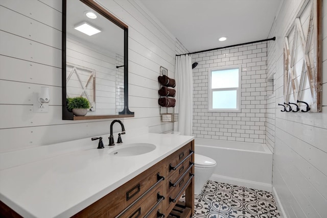 full bathroom with shower / tub combo with curtain, vanity, tile patterned floors, toilet, and wood walls