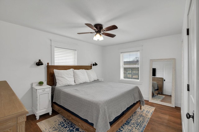 bedroom featuring ceiling fan and dark hardwood / wood-style floors