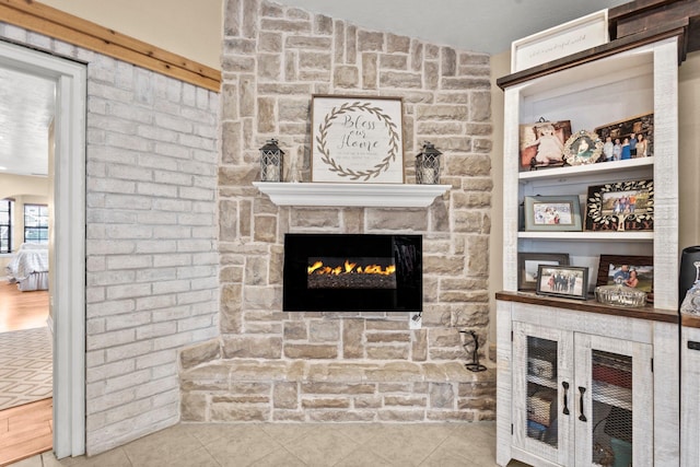 103 Read St, Silsbee, TX 77656 - tiled living room with a stone fireplace