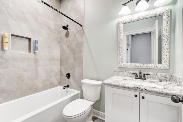 full bathroom with vanity, toilet, and tiled shower / bath combo