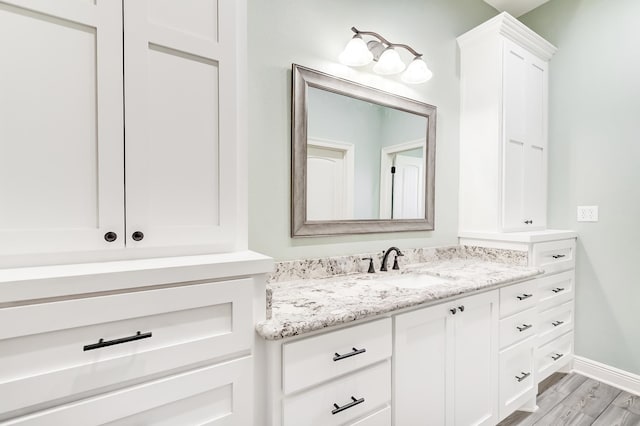 bathroom featuring wood-type flooring and vanity