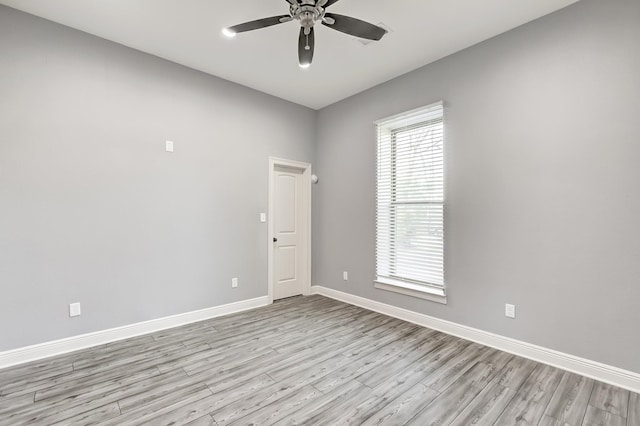 unfurnished room featuring light hardwood / wood-style flooring and ceiling fan