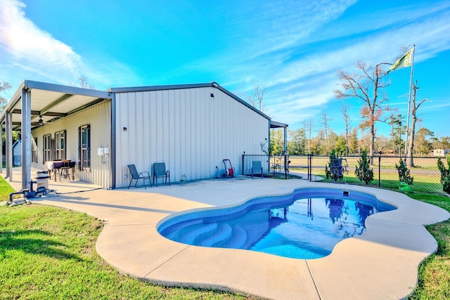 view of pool with ceiling fan and a patio area