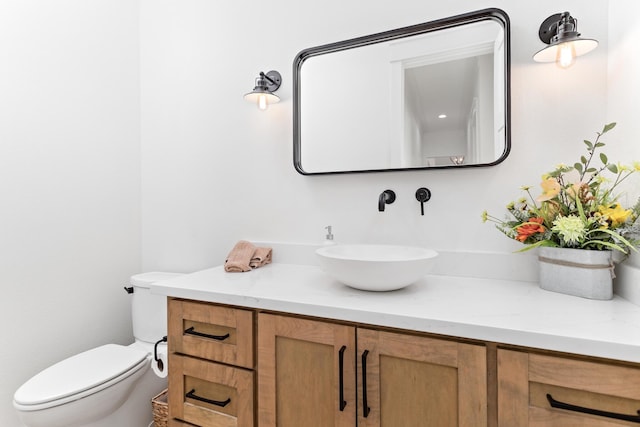 bathroom with vanity and toilet