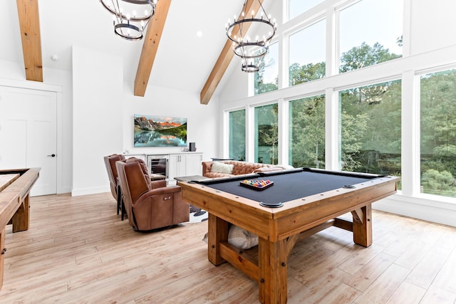 game room with beamed ceiling, high vaulted ceiling, pool table, and light hardwood / wood-style flooring