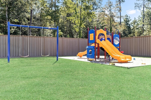 view of playground featuring a lawn