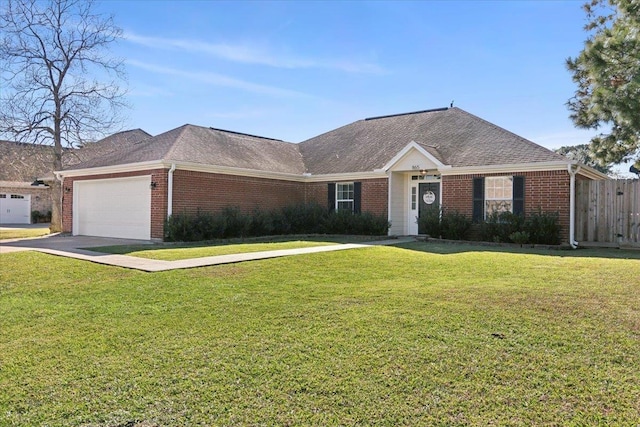 single story home featuring a garage and a front lawn