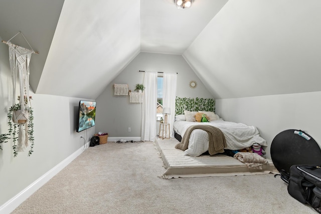 bedroom with lofted ceiling and carpet flooring