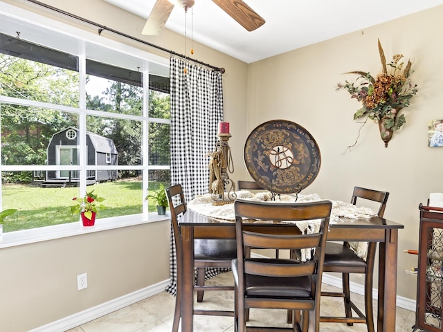 dining space with ceiling fan