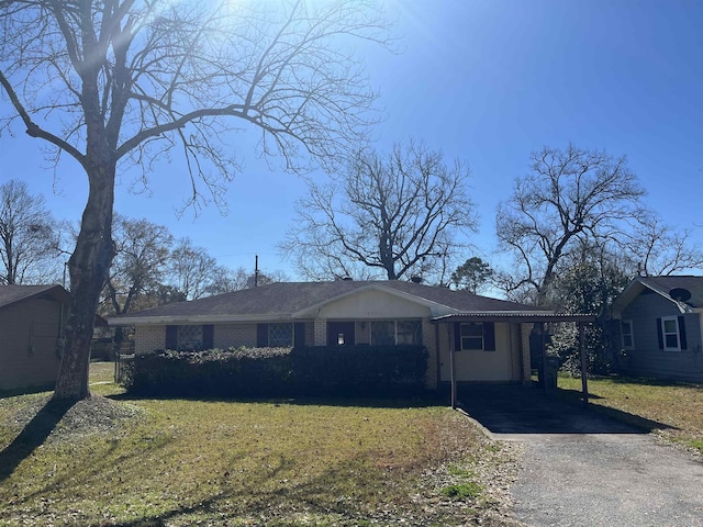 single story home with a carport and a front yard