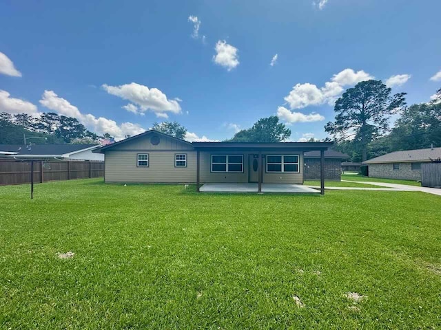 207 Lucky Dr, Silsbee, TX 77656 - rear view of house featuring a patio