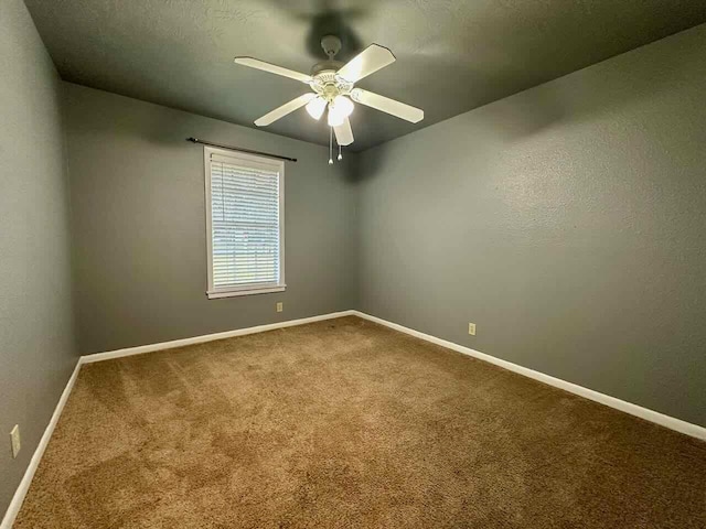 207 Lucky Dr, Silsbee, TX 77656 - carpeted spare room featuring baseboards and ceiling fan