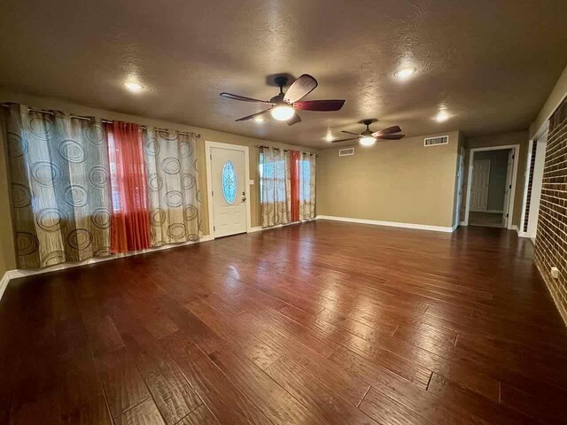 207 Lucky Dr, Silsbee, TX 77656 - empty room featuring a ceiling fan, hardwood / wood-style floors, baseboards, a textured ceiling, and recessed lighting