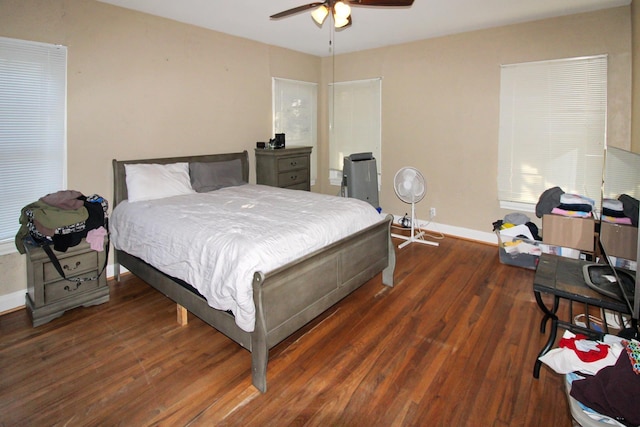 bedroom with ceiling fan and dark wood-type flooring