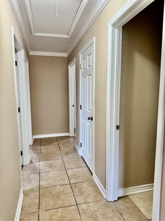 414 David St, Bridge City, TX 77611 - hallway featuring light tile patterned flooring, ornamental molding, and attic access