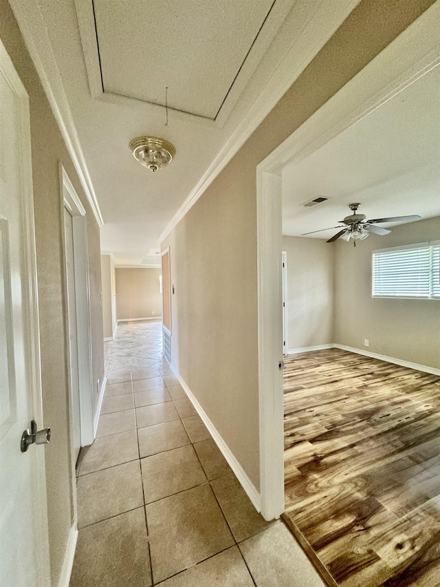 414 David St, Bridge City, TX 77611 - hall featuring ornamental molding, tile patterned floors, attic access, baseboards, and a textured ceiling