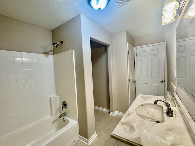 414 David St, Bridge City, TX 77611 - full bath featuring  shower combination, tile patterned floors, vanity, and baseboards