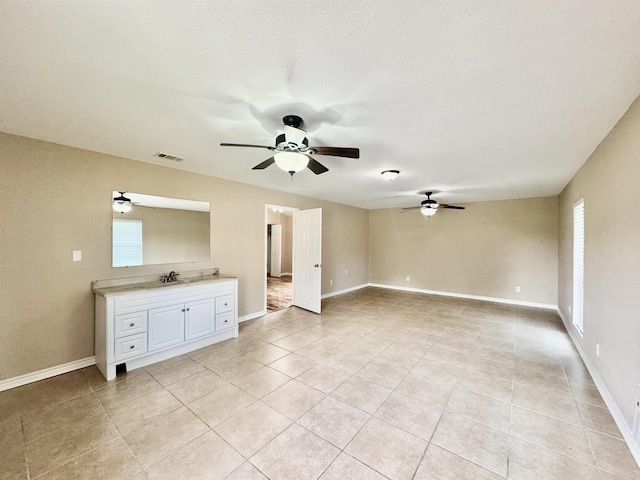 414 David St, Bridge City, TX 77611 - unfurnished room with a ceiling fan, light tile patterned floors, and baseboards