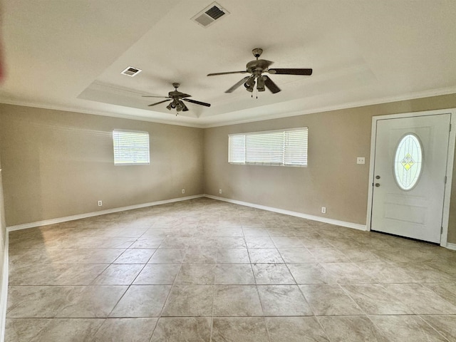 414 David St, Bridge City, TX 77611 - foyer with a raised ceiling, ornamental molding, ceiling fan, light tile patterned floors, and baseboards