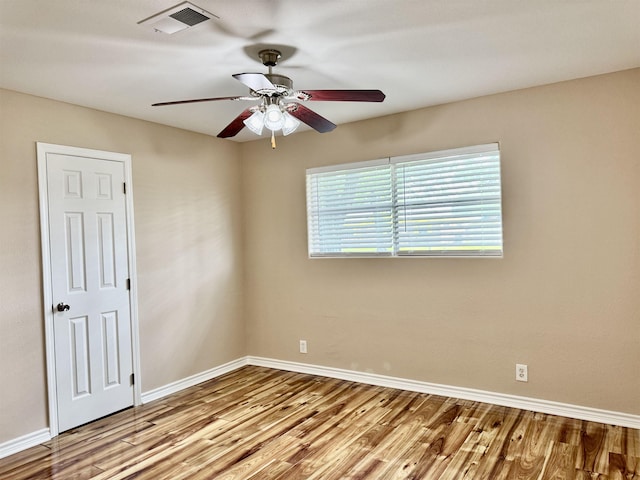 414 David St, Bridge City, TX 77611 - spare room featuring wood finished floors, ceiling fan, and baseboards